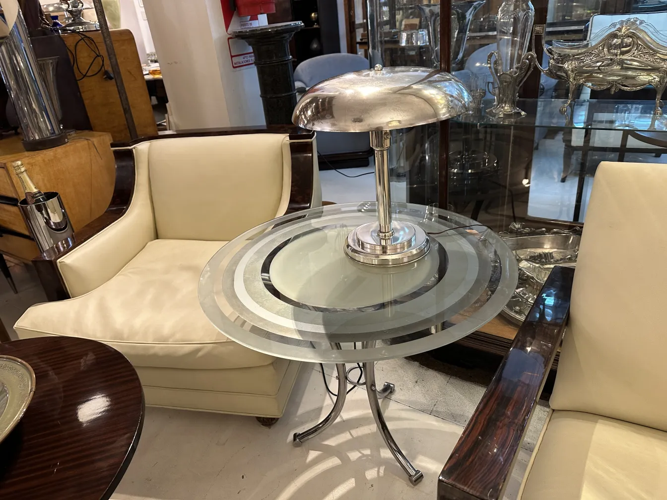 Antique table lamp with round base and metal shade.