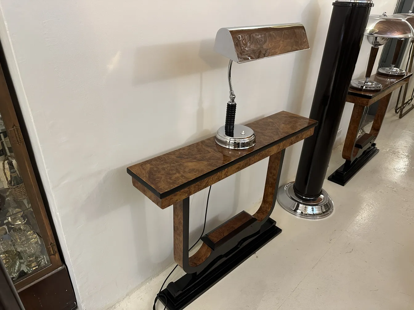 antique table lamp with unique design and decorative base, in an antique setting.