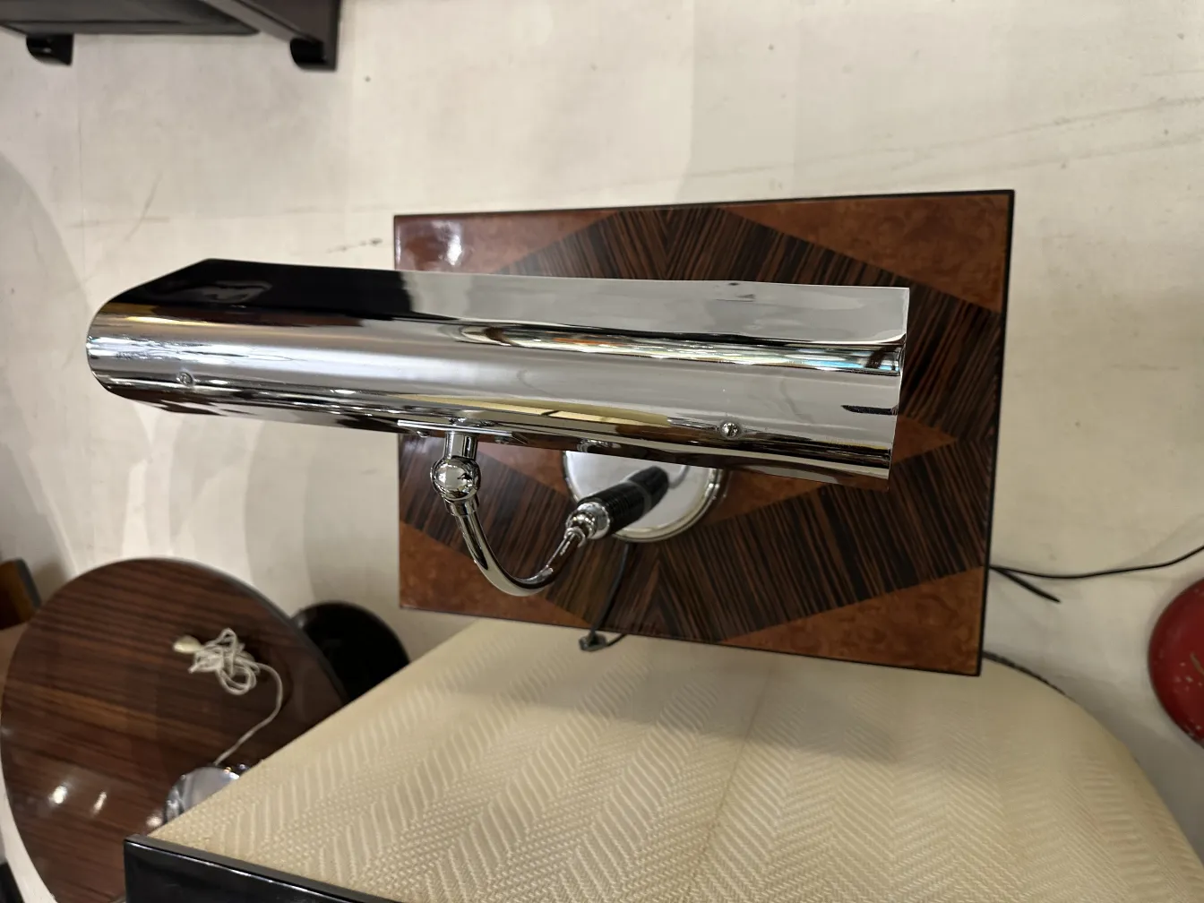 Antique table lamp featuring elegant design and chrome details in a classic setting.