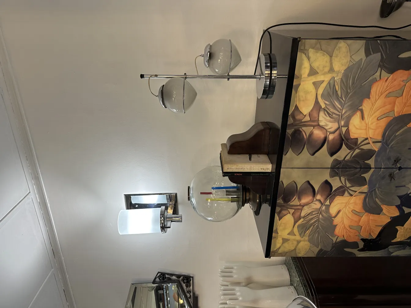 Antique table lamp with two light spheres and floral background