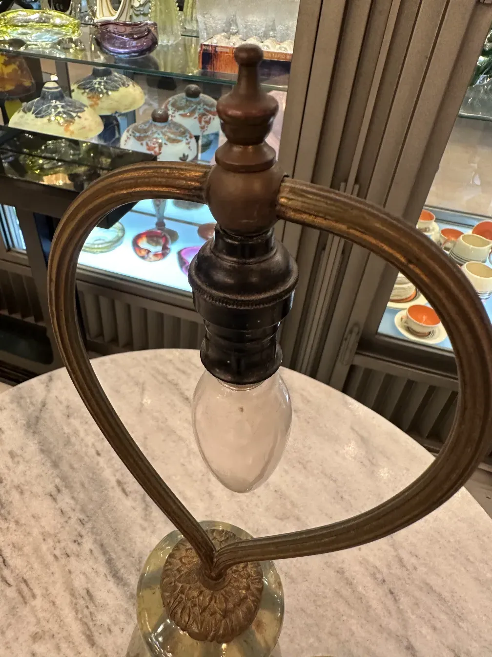 antique table lamp with unique design in elchinger fils soufflenheim alsace, colorful glass background