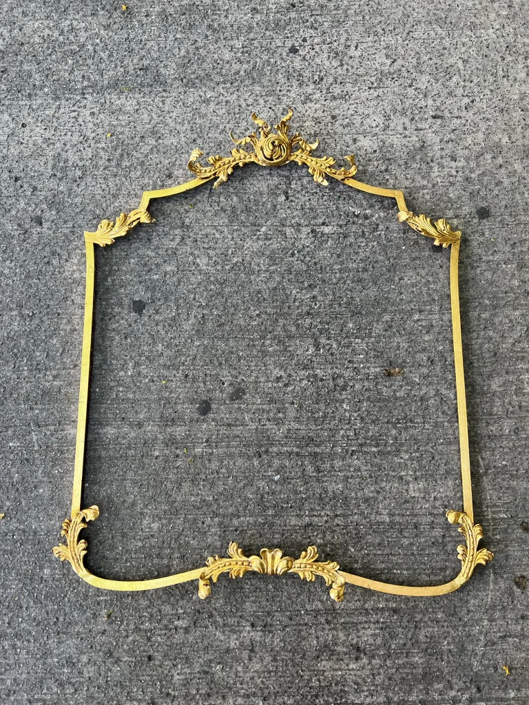 antique console with ornate design on gray background