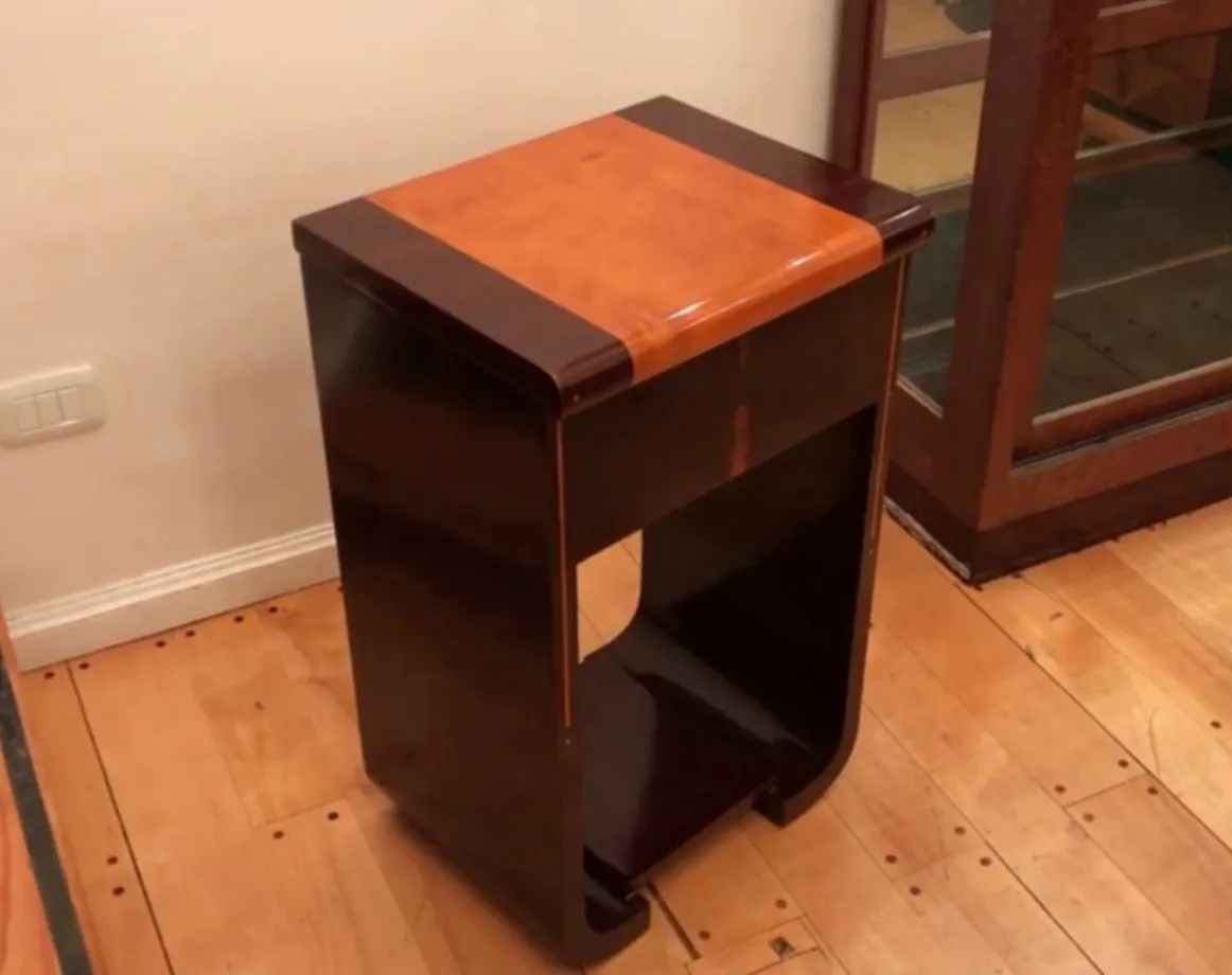 Elegant antique console with brown design and shape.