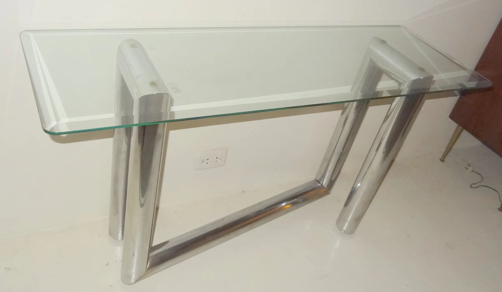 elegant antique console with a glass top