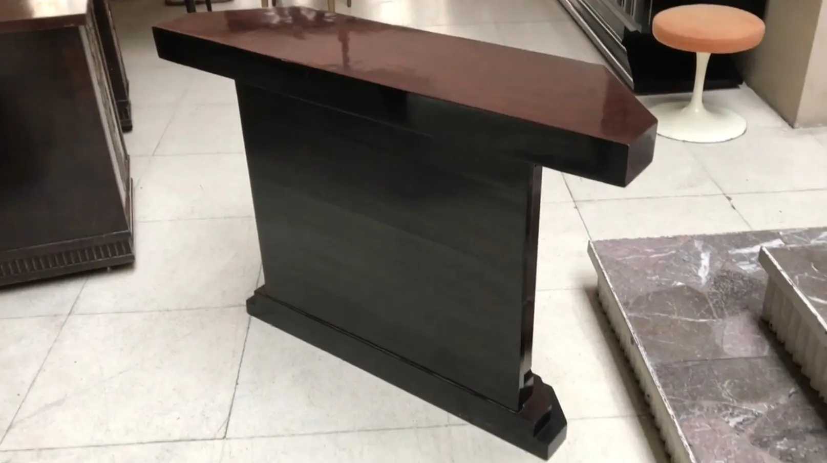 Elegant antique console with unique details.