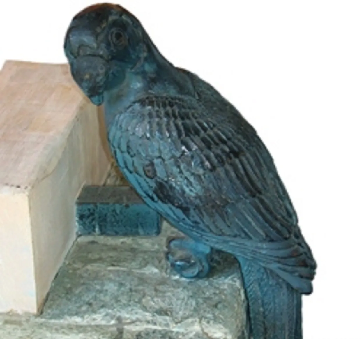 Antique console featuring a bird on top.