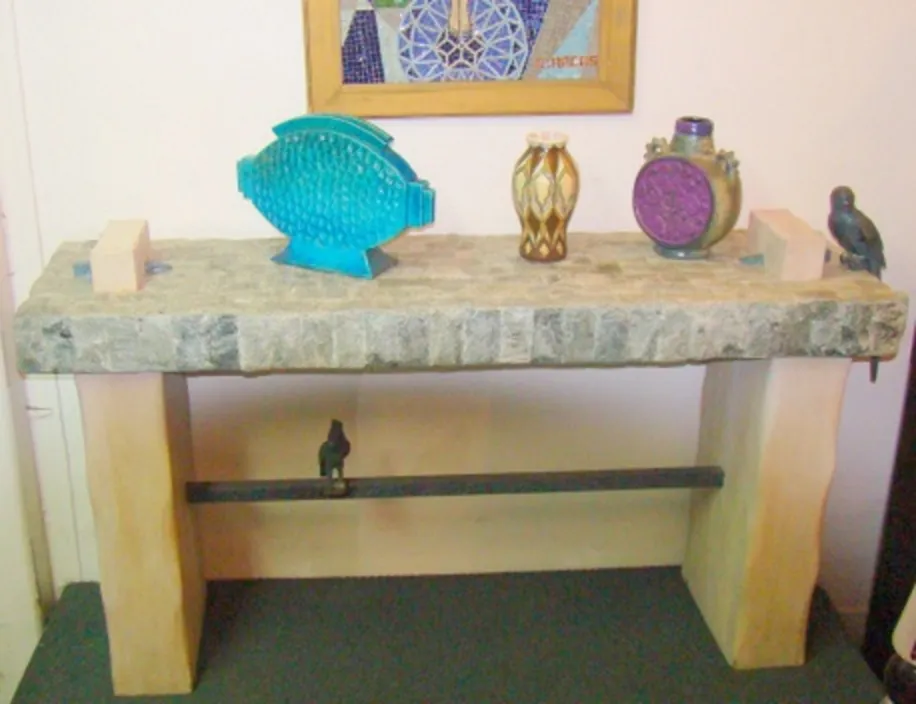antique console table with decorative items on top