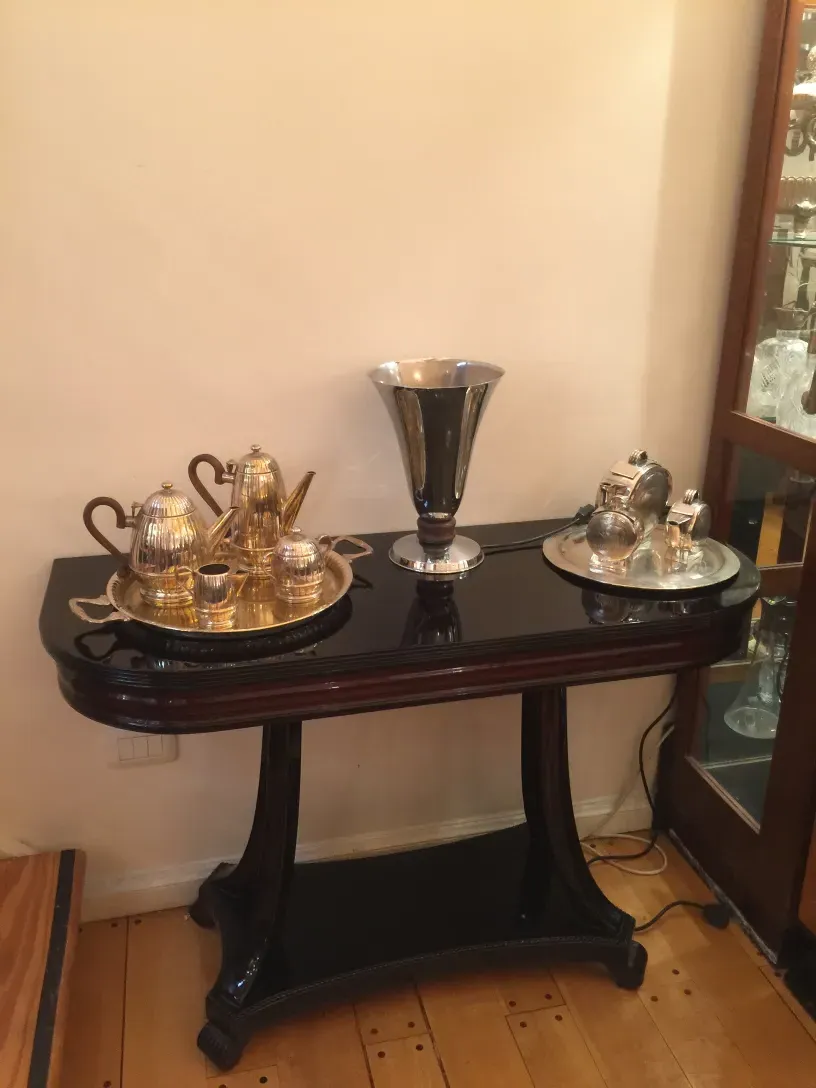 antique console with decorative items