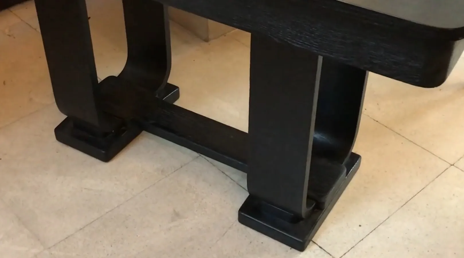 antique console table with decorative black base