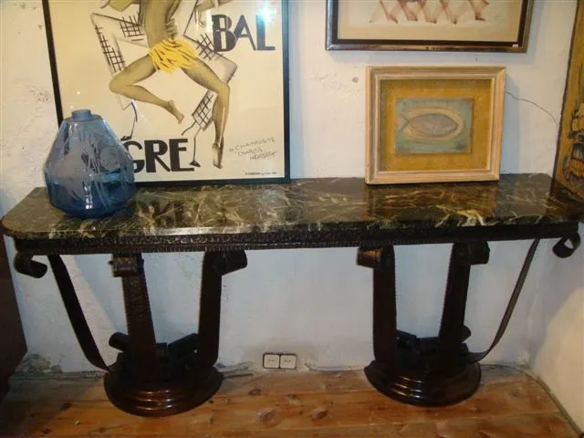 antique console with unique legs and minimalist design