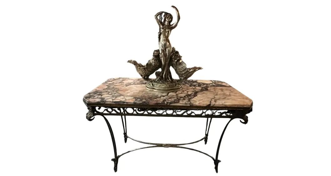 antique console with decorative figure and classic design