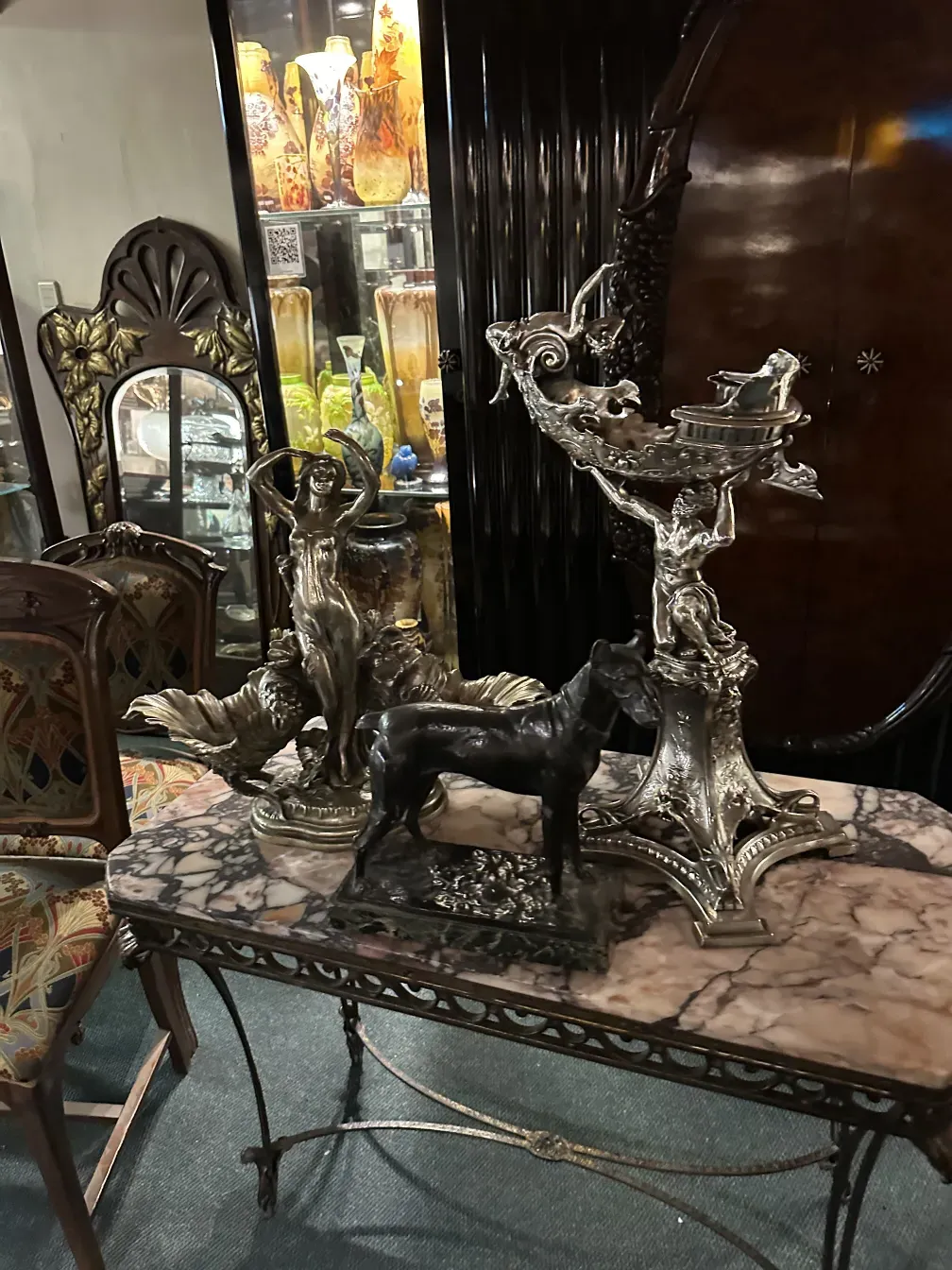 antique console with intricate details and decorative figures