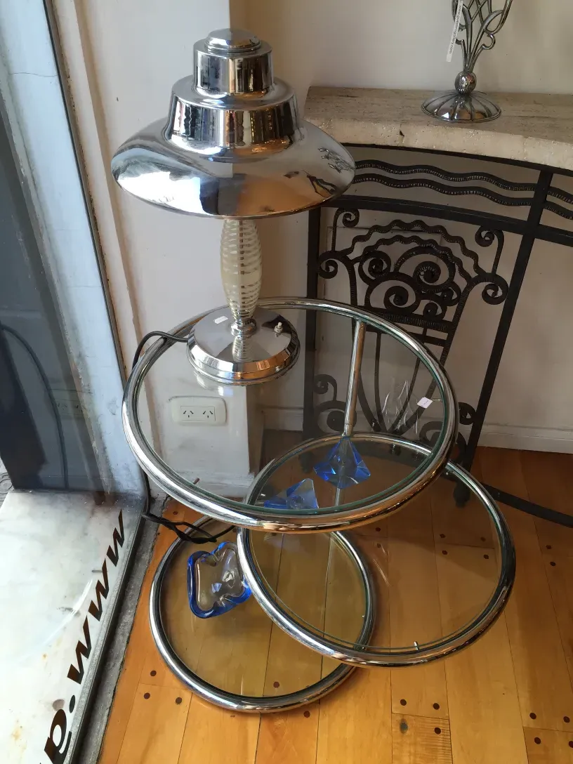 Antique decorative console with shiny base and elegant design.