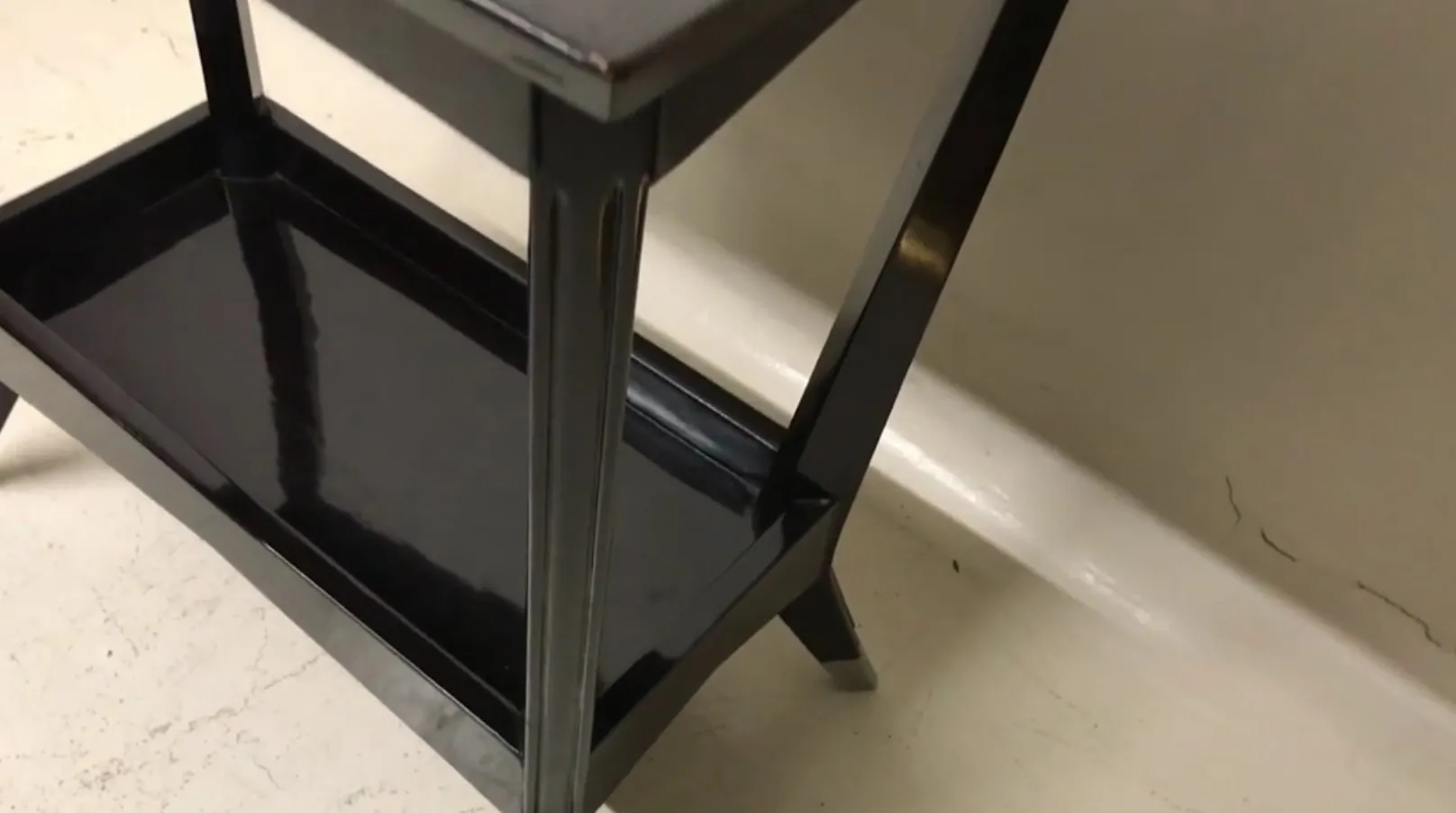 Black antique console with elegant details.