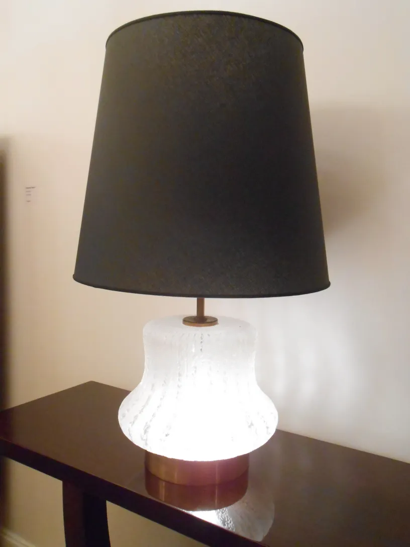 Antique console with light, modern black shade.