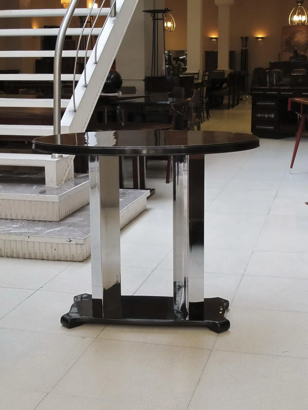 Antique console with modern base in an elegant setting.