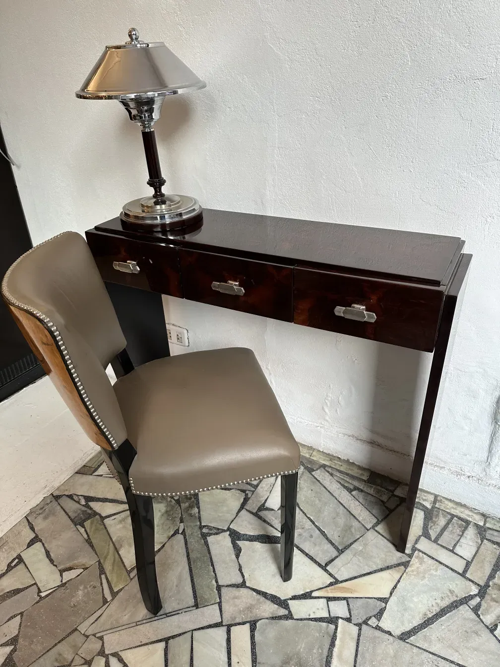 antique console with lamp and classic design chair