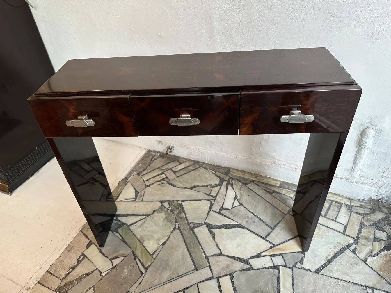 two antique consoles featuring three drawers