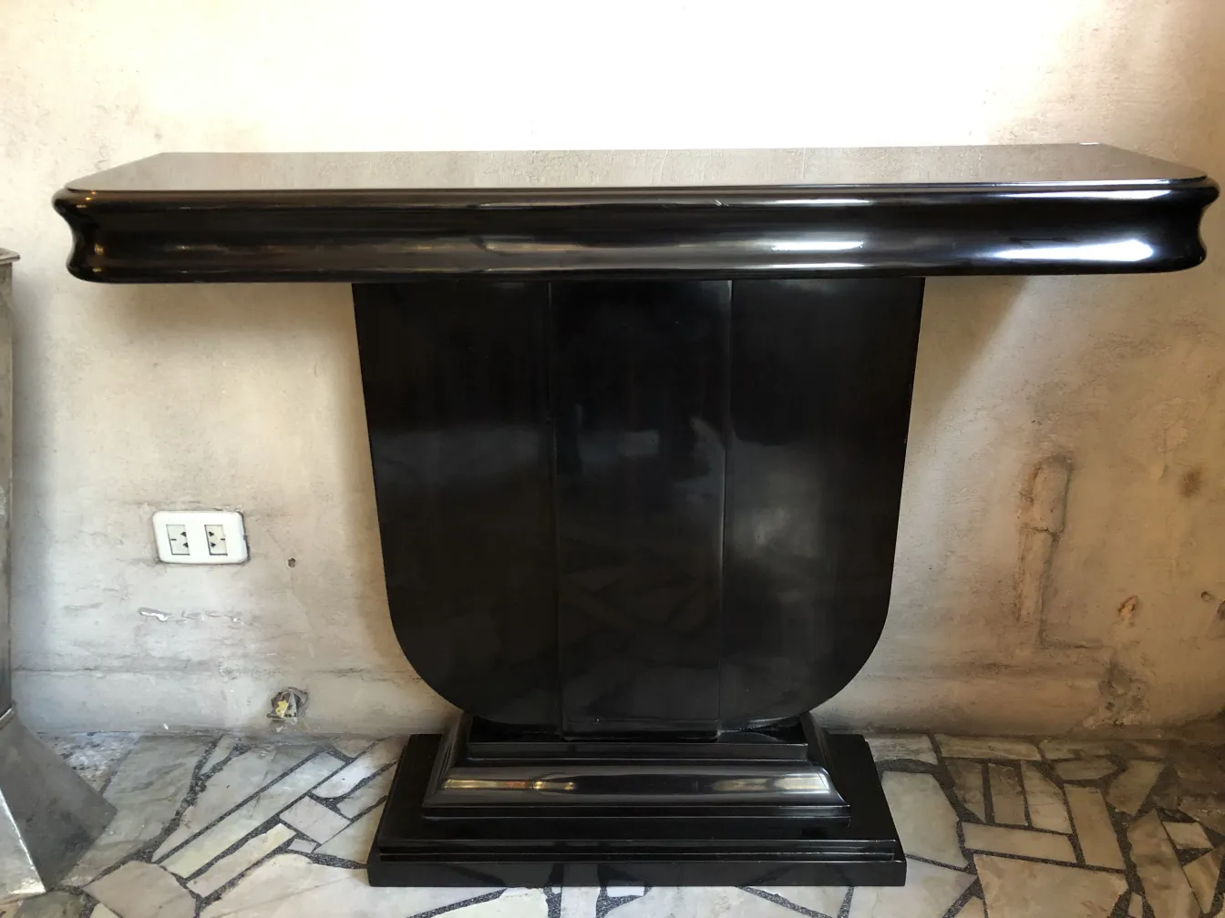 two antique consoles with an elegant design in a neutral setting