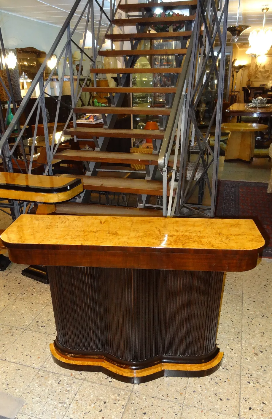 two antique consoles in a decorative setting