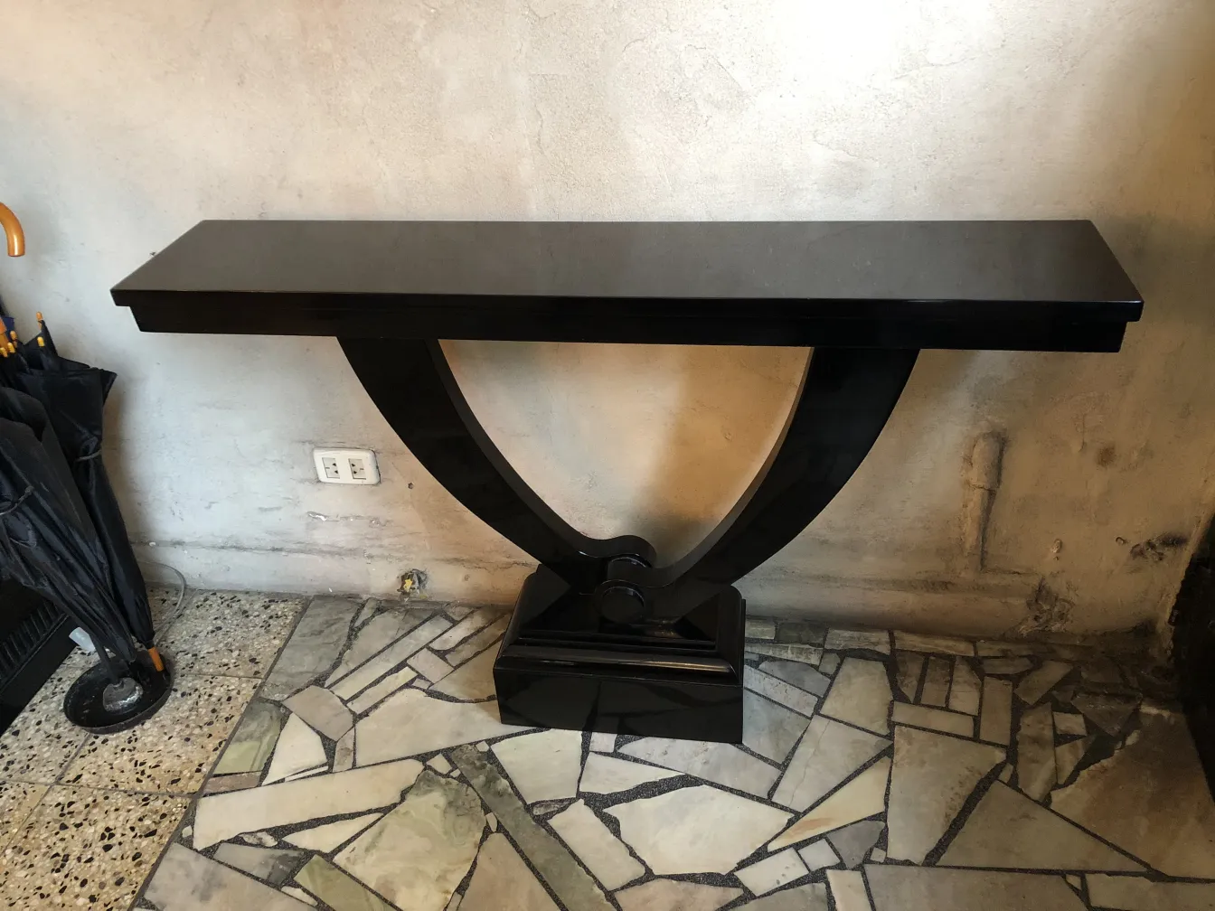 two antique consoles with elegant design and distinctive base