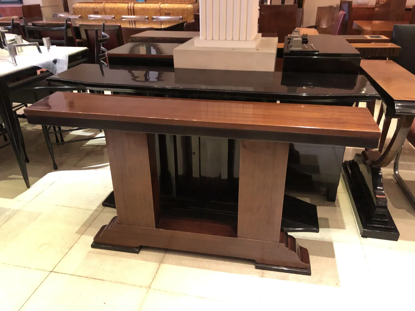 three antique consoles in a stylish setting