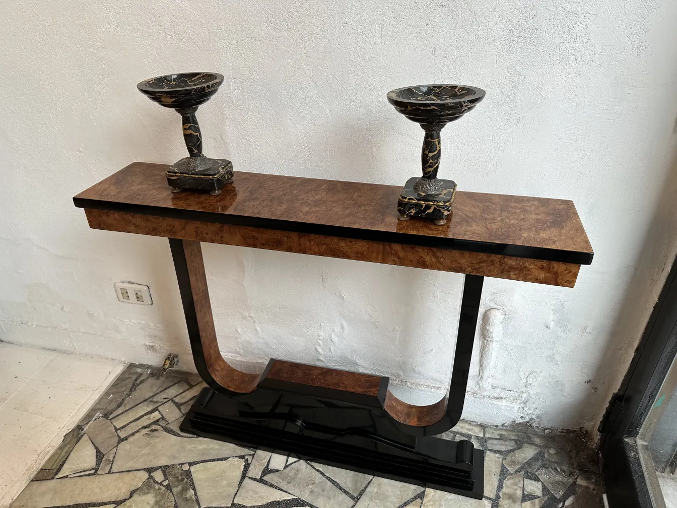 Three antique consoles with elaborate decorations and elegant style