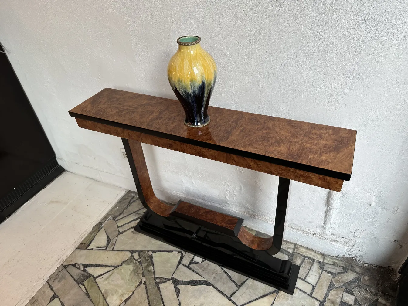 Three antique consoles for decoration with a vase on top