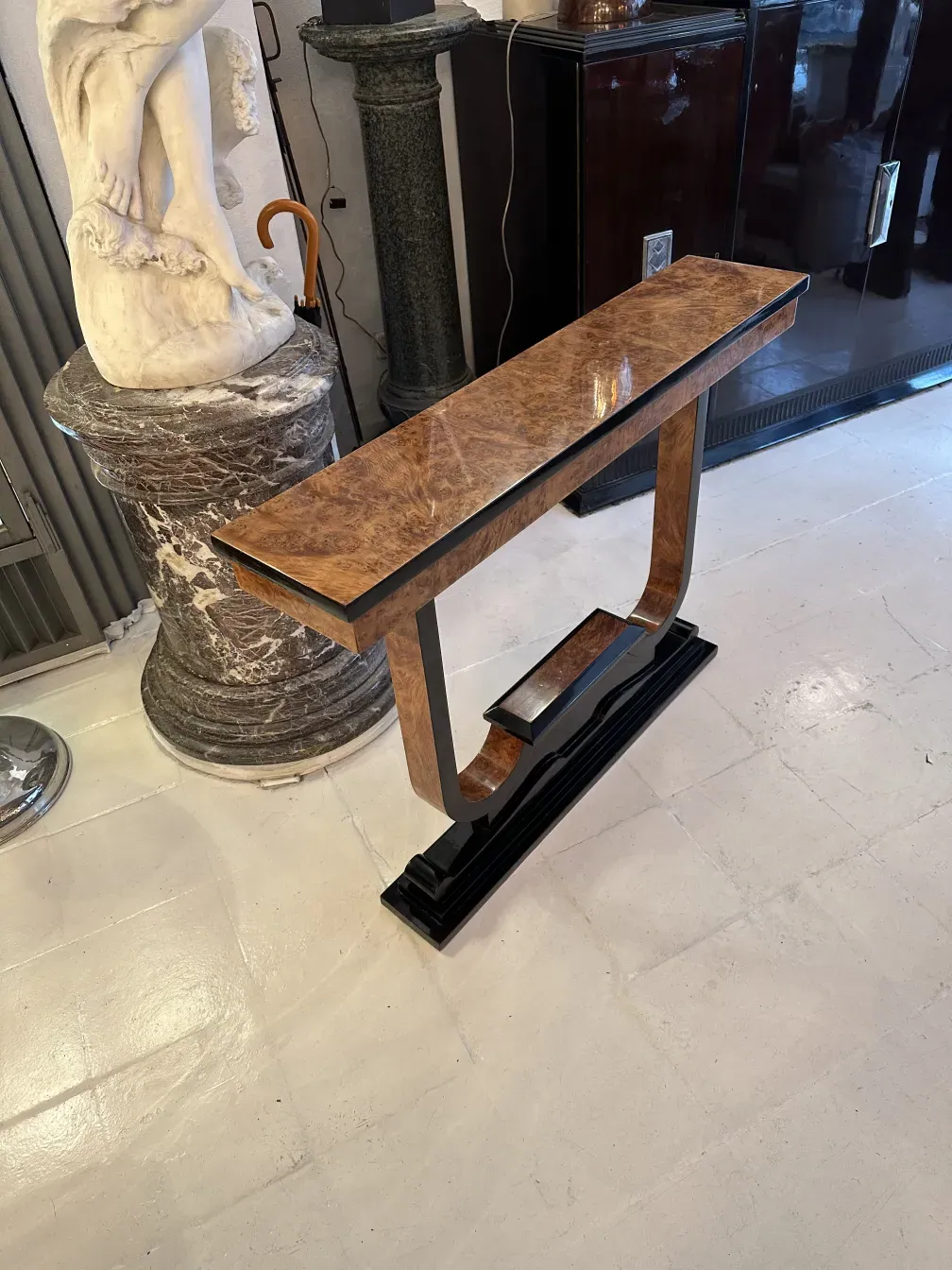 Three antique consoles with unique decorative features.