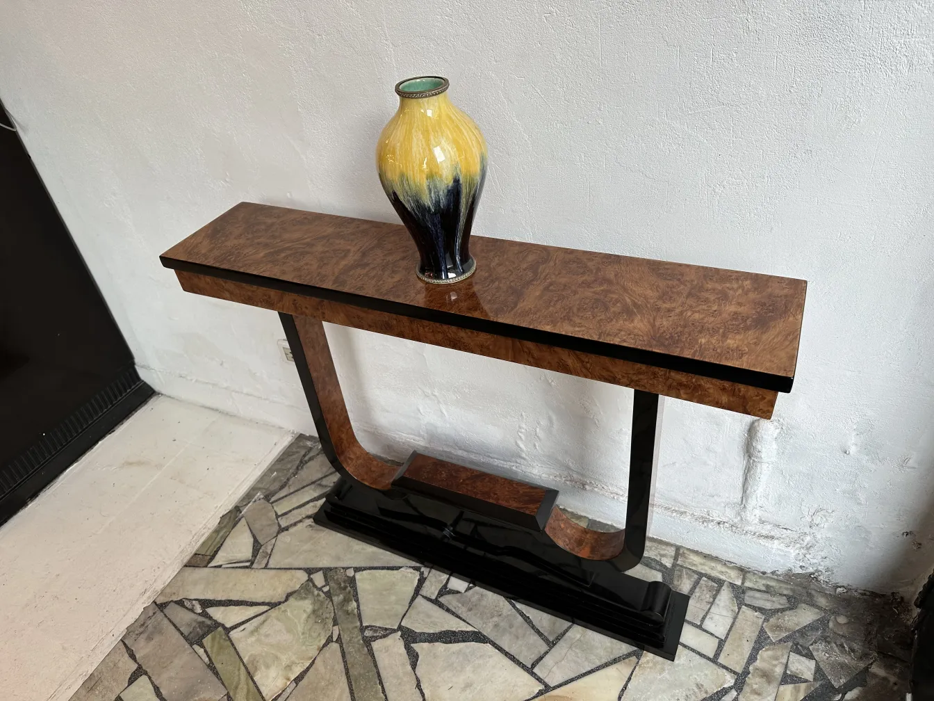 three antique consoles with decorative vase on top