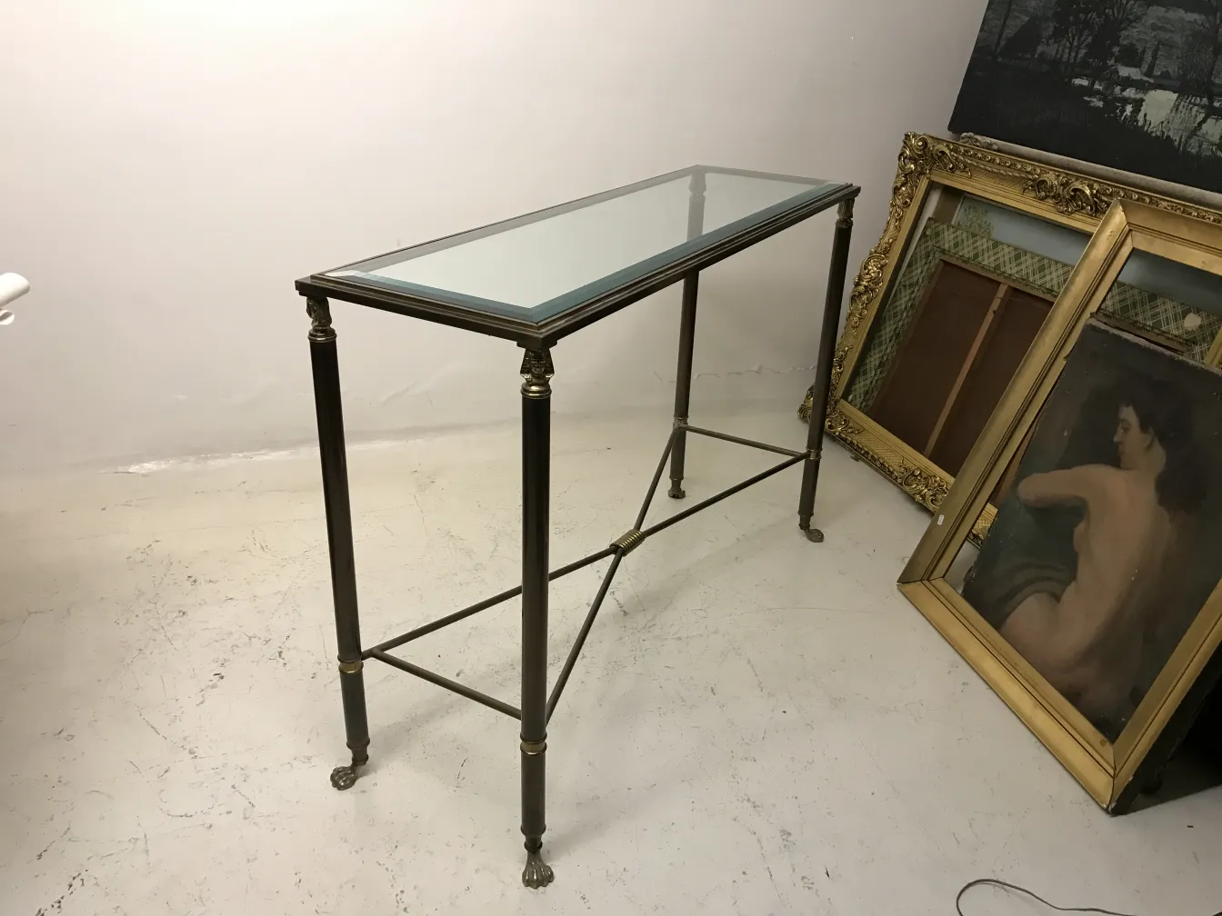 Three antique consoles with elegant design in an artistic setting