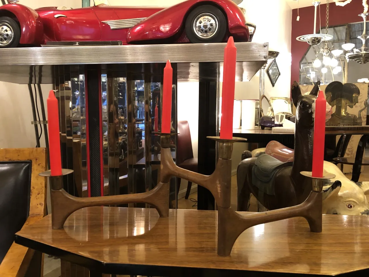 Antique candelabra with red candles in a stylish setting