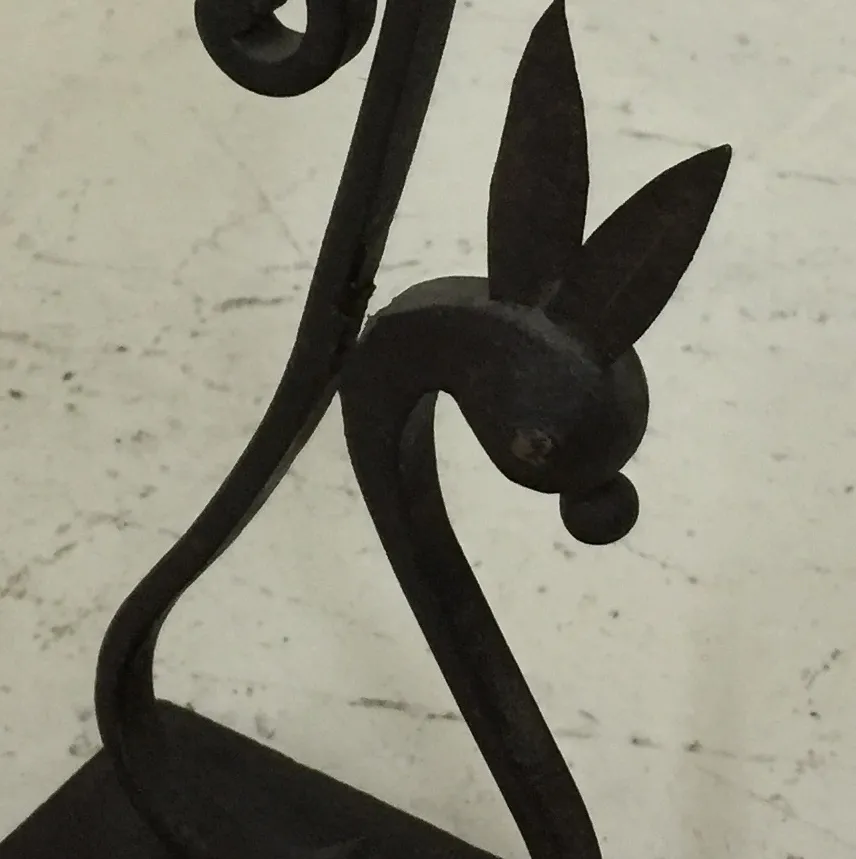 Antique candelabra with relief details, decorative and elegant, suitable for classic settings.