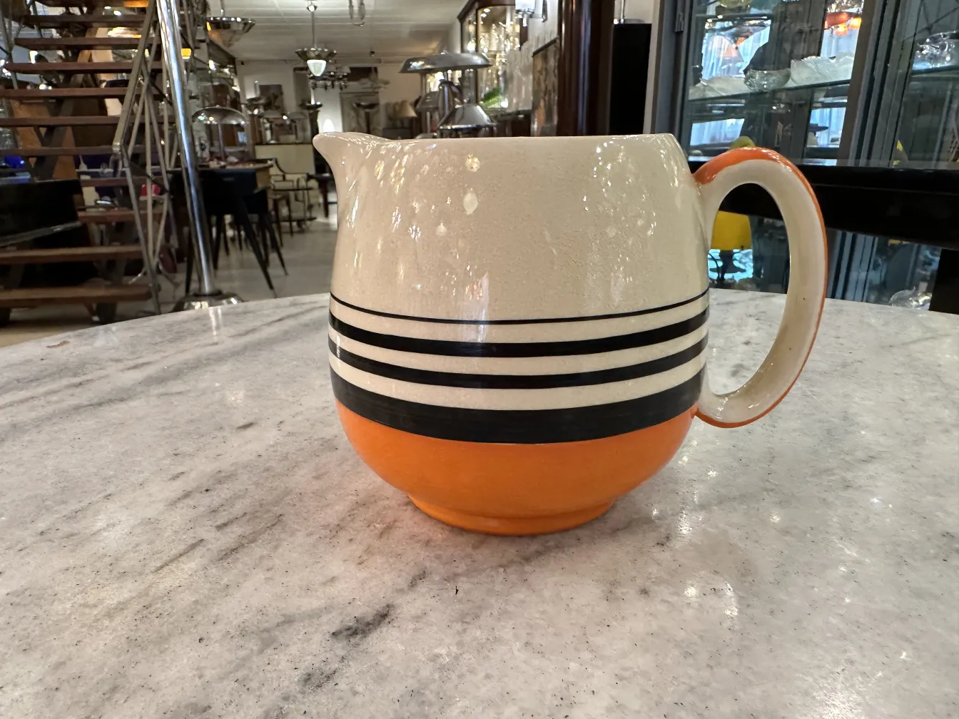 Antique tea set with colorful design on a table