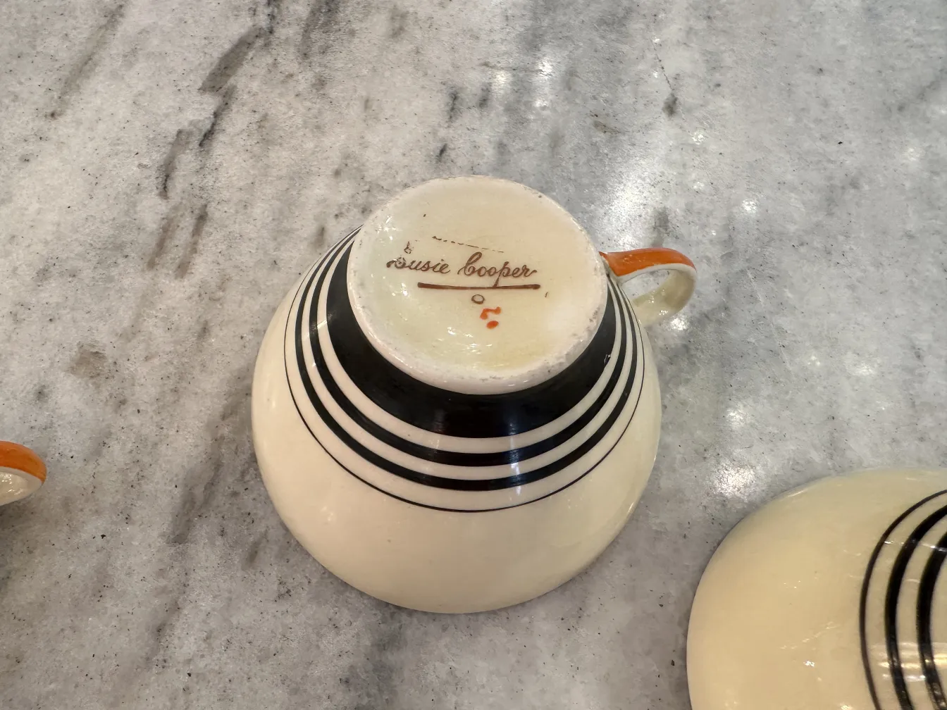 antique tea set featuring black and orange details