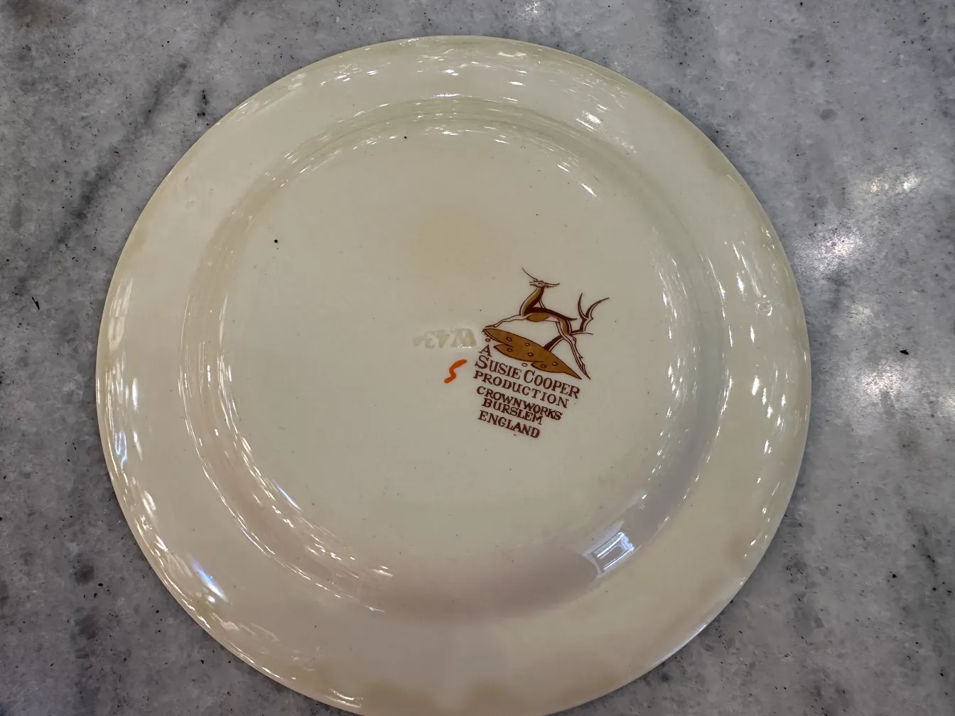 Antique tea set with decorated plate on the bottom.