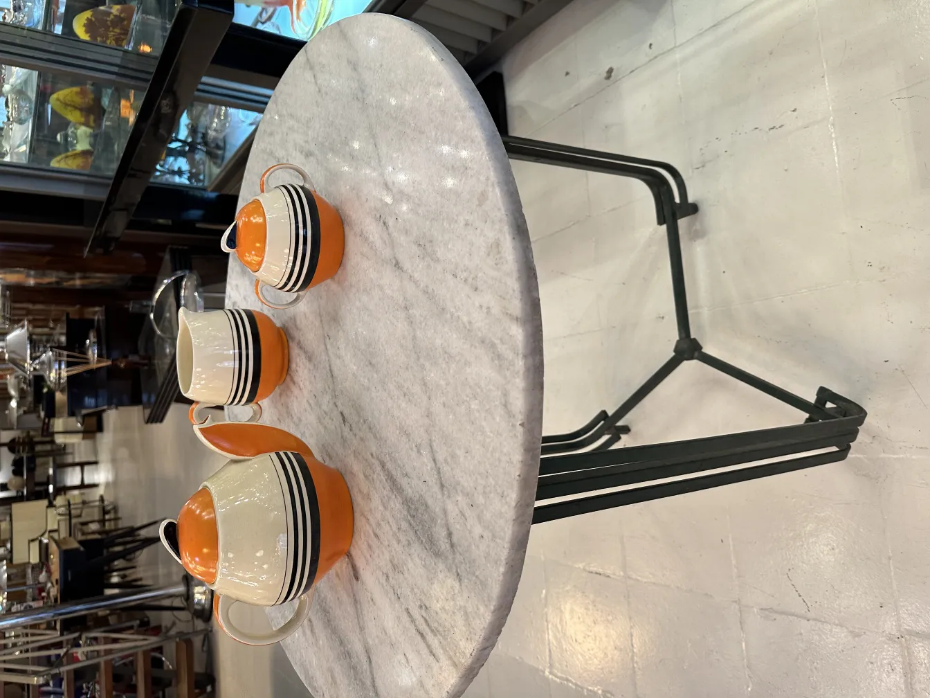 antique tea set with colorful cups on a table