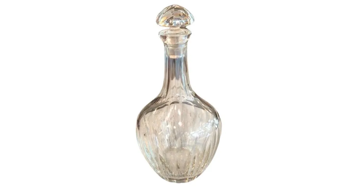 antique bottle with a long neck and elegant shape made of crystal