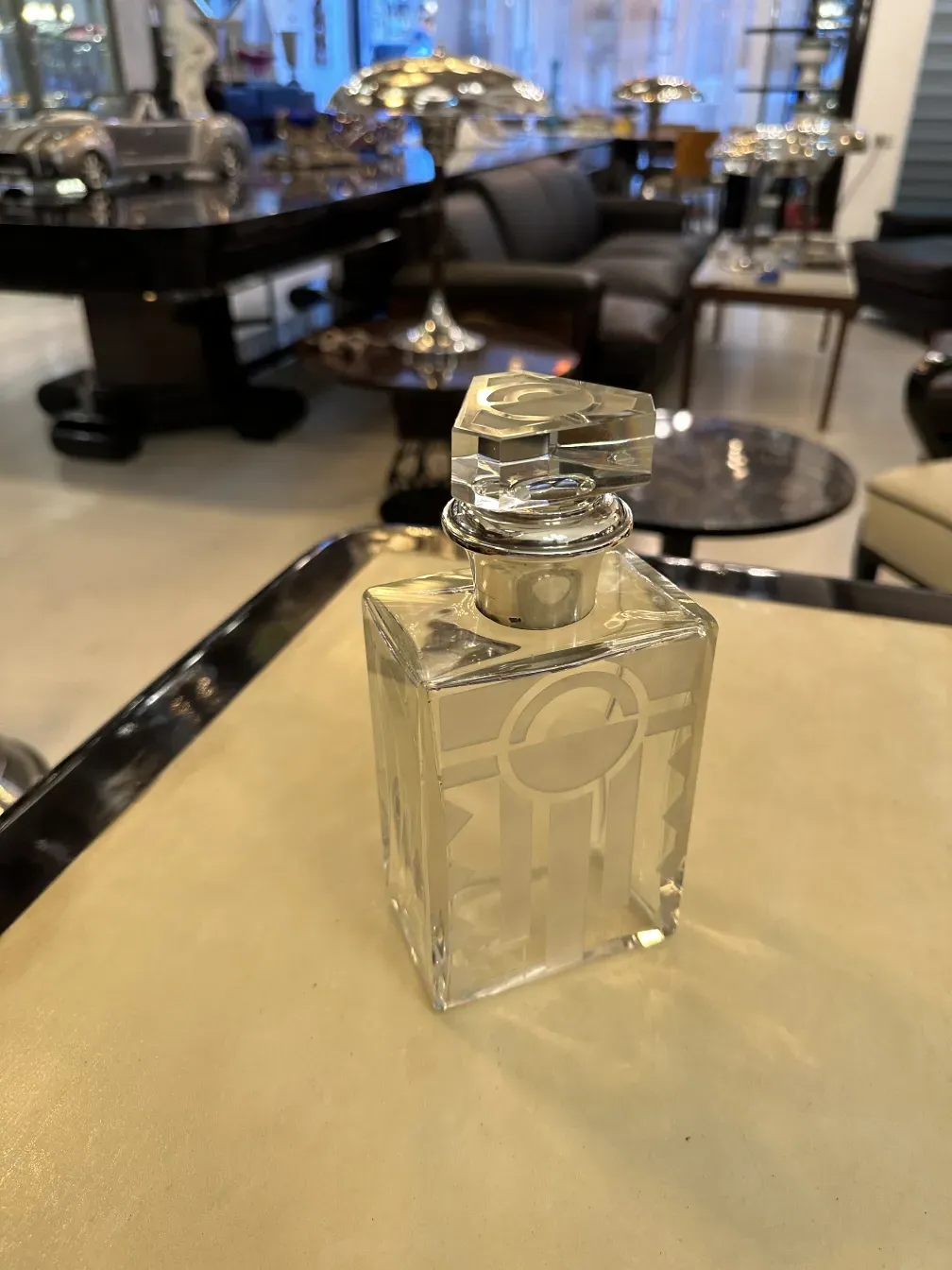 Antique bottle with decorative design in glass