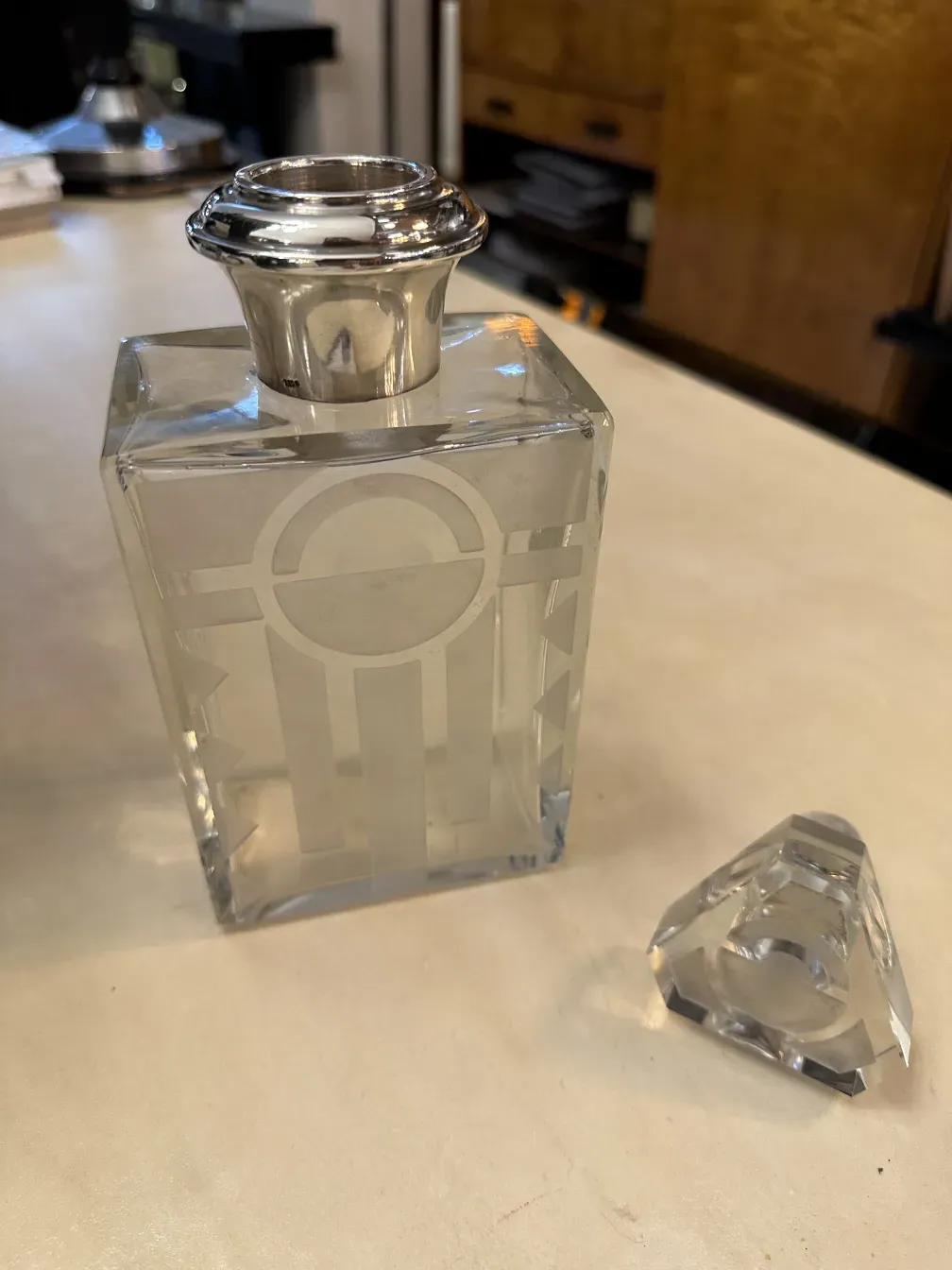 antique glass bottle with decorative lid