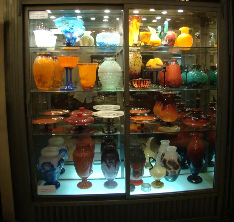 Display of antique signed glass by Muller Fres