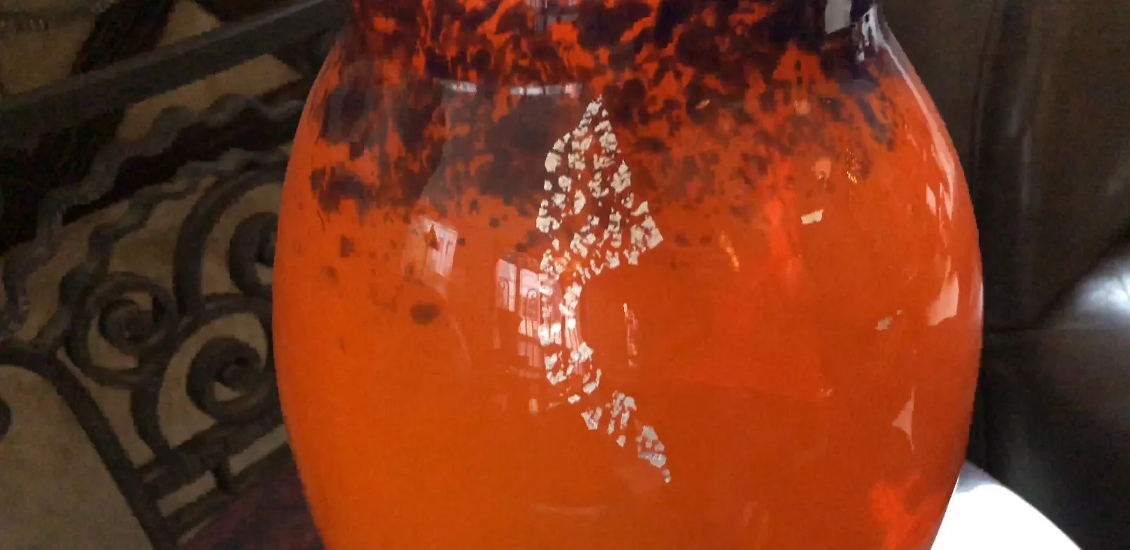 signed glass in orange tones with unique details, antique