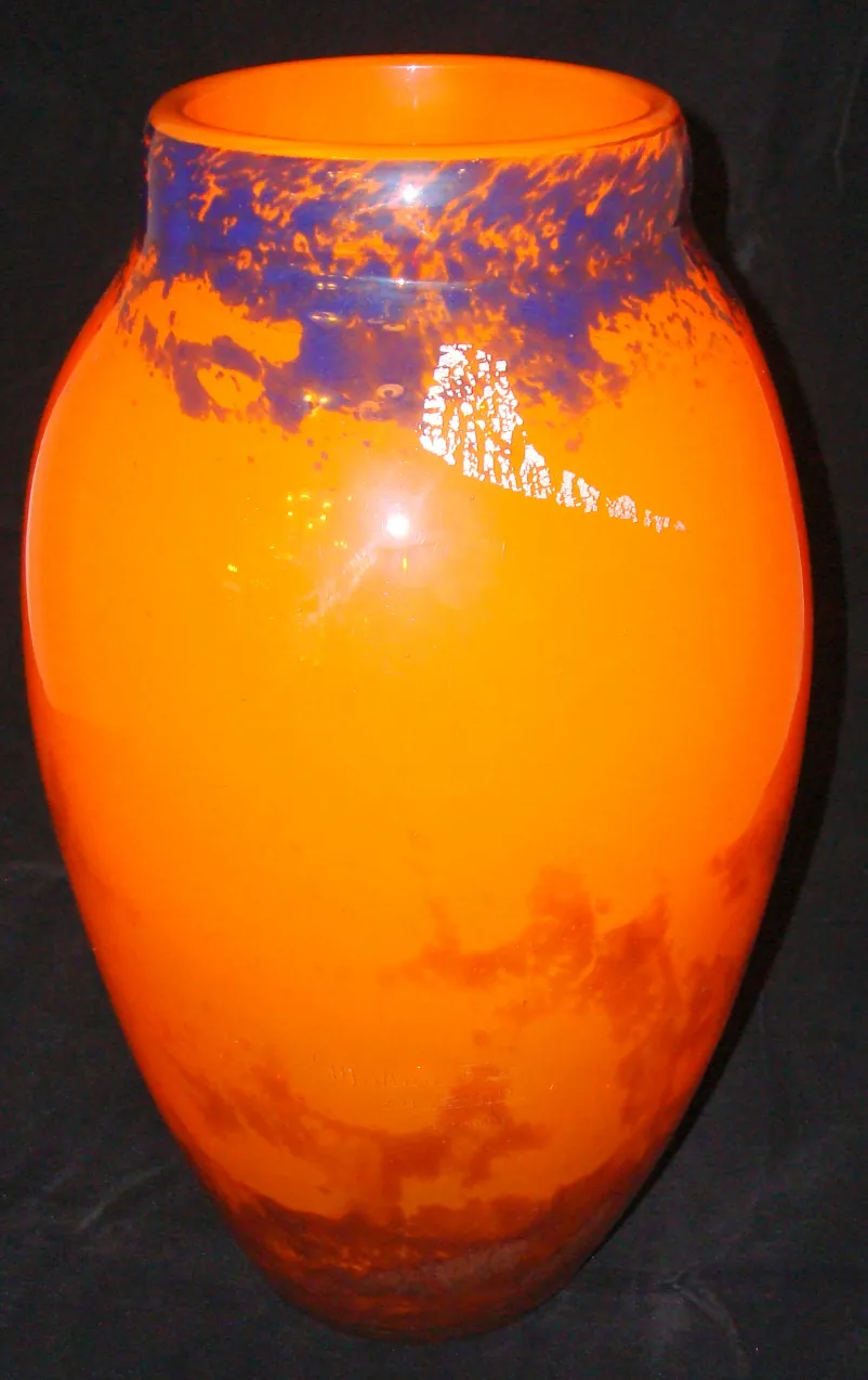 Thick and vibrant signed glass Muller Fres in orange and blue, featuring a classic shape.