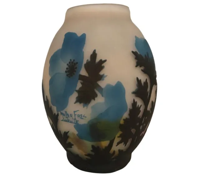 Antique signed glass by Muller Fres adorned with blue flowers.