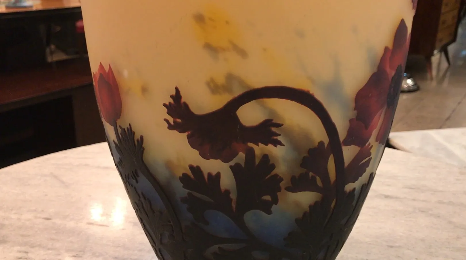 Glass signed Muller Fres featuring floral design in an antique setting