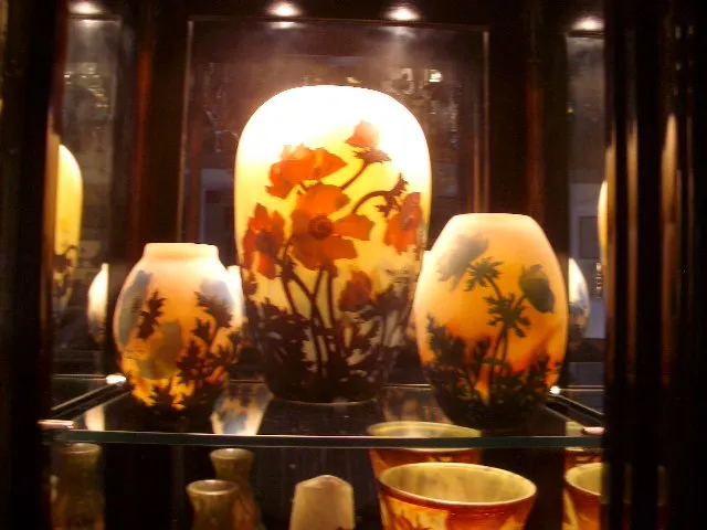 Antique signed glass by Muller Freres displayed