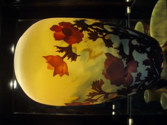 Antique glass vase with red flower designs by Muller Fres.