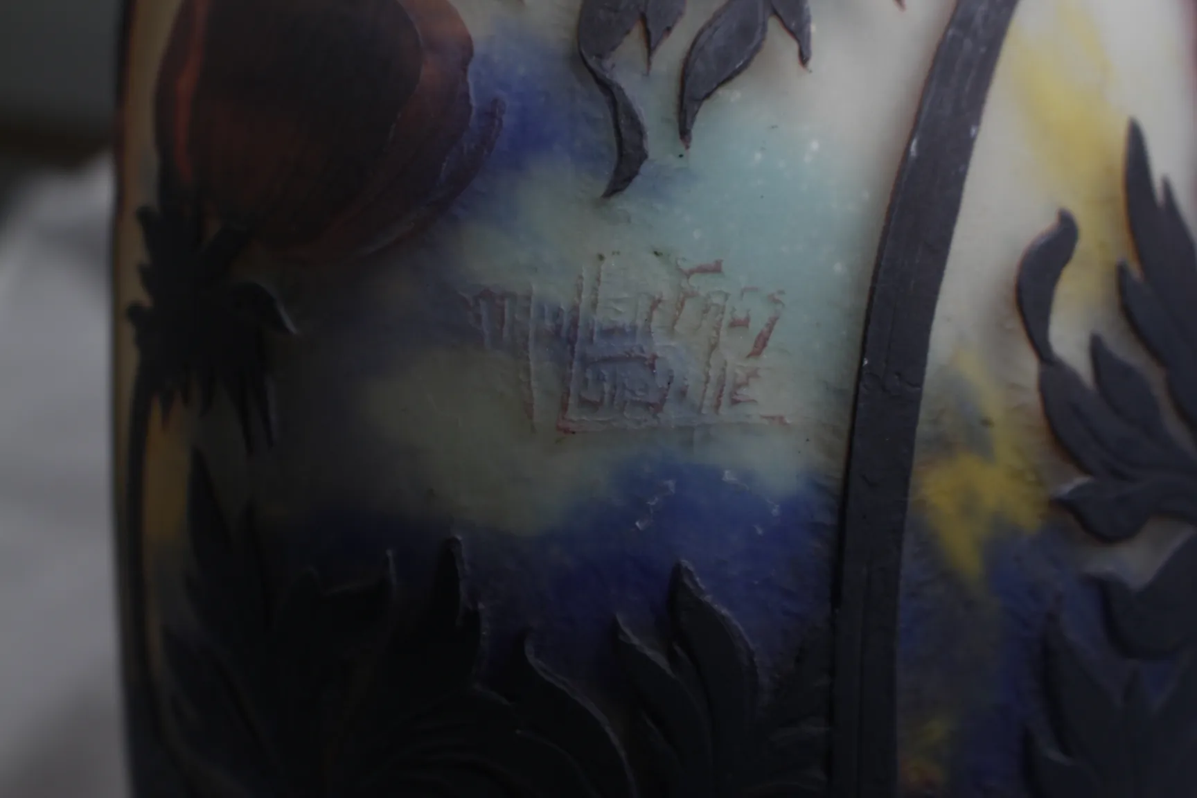 Signed glass by Muller Fres with colored details and relief.