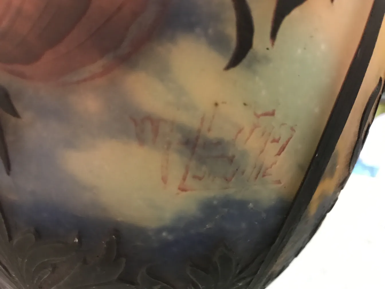 Antique signed glass by Muller Fres with vivid floral patterns.