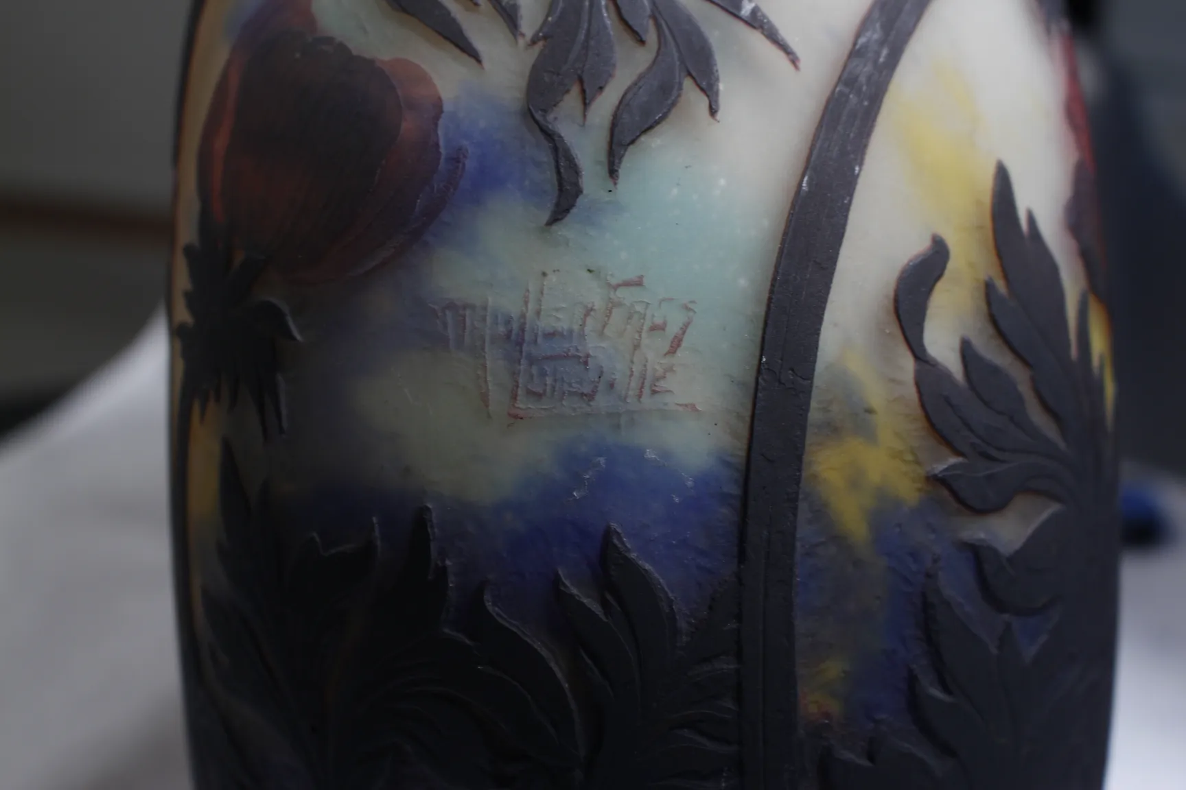 Signed glass Muller Freres featuring floral design in vibrant colors.